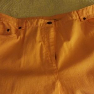 Peach colored cropped pants.